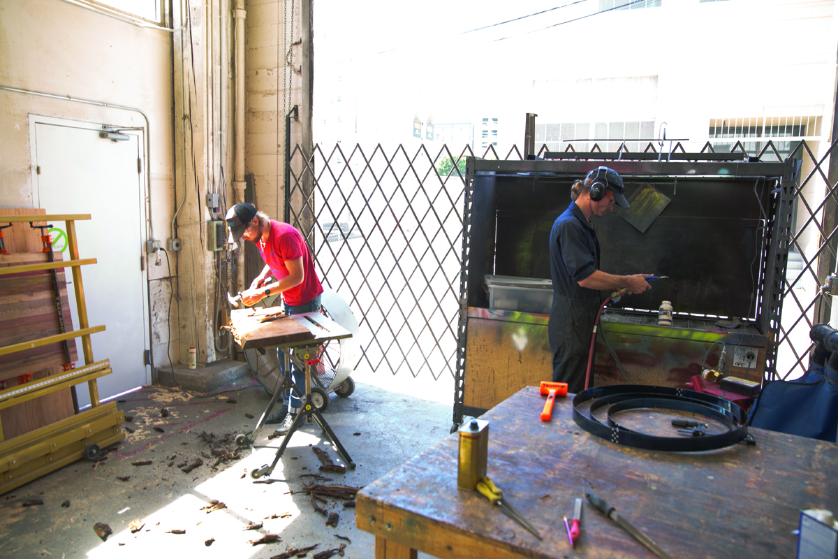 7. The back entrance is oversized to allow large projects and materials. Beside it, a powder-coating station is big enough for a motorcycle body.